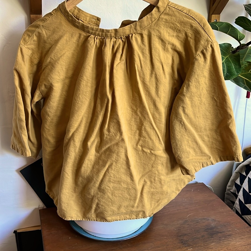 Mustard yellow top.